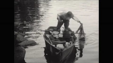 Fisherman in Canoe with Fish  Stock Footage 56162300