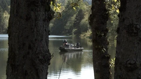 Fisherman Casting From Boat At The Lake Stock Footage 107613053