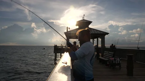 Fisherman Casting Off Deerfield Beach Pier After Sunrise Stock Footage 208956527