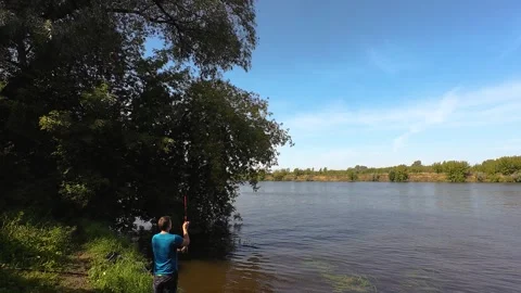 Fisherman casting feeder rod in slow motion 4K Stock Footage 316173451