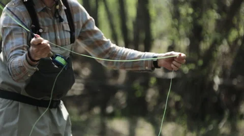 Fisherman casting with fly rod Stock Footage 51679298