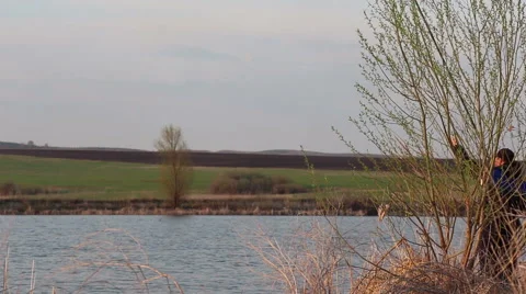 Fisherman casting off at a lake Video stock 51227103