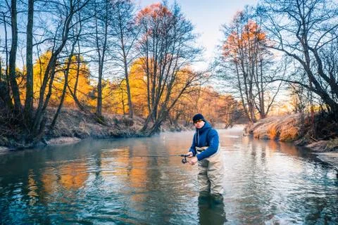 Fisherman with casting rod Foto stock
