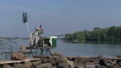 Fisherman casts into the water Stock Footage 95800739