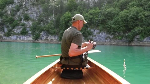 Fisherman catch fish from canoe Video stock 276787975