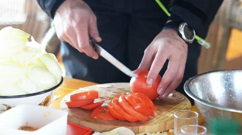 A fisherman chopped vegetables. Stock Footage 44672215