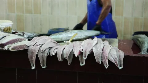 A Fisherman cleans the fish on the counter Stock Footage 208678963