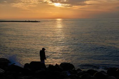 Fisherman at dawn Stock Photos