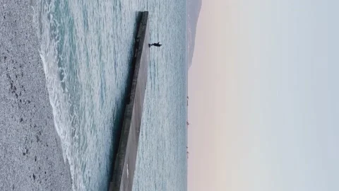 A fisherman on a dock 4k vertical Stock Footage 145405653