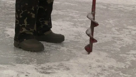 Fisherman drilling ice Stock Footage 72120766