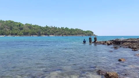A Fisherman fall down in the     sea while fishing Stock-Footage 241343885