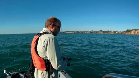 Fisherman fights jumping fish Stock Footage 74290613