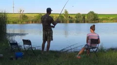 Blonde Young American Girl Fisherman is Fishing on the Forest Lake