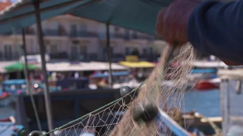 Fisherman Fixing His Nets After Fishing 스톡 동영상 244017583