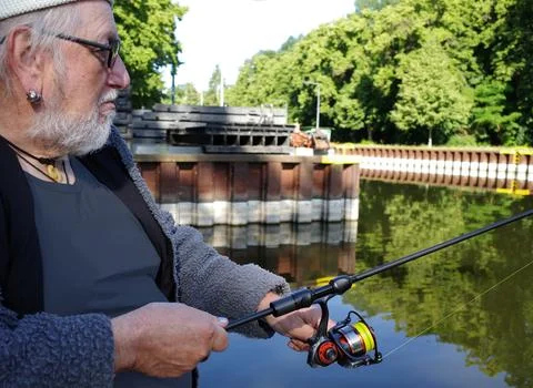 A  fisherman in front of a lock Stock Photos