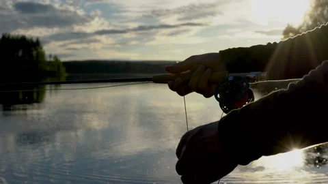 This is a fisherman going to the river to fly-fish Stock Footage 201405461
