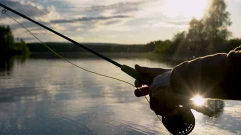 This is a fisherman going to the river to fly-fish Stock Footage 201405603