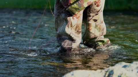 This is a fisherman going to the river to fly-fish Stock Footage 201842075