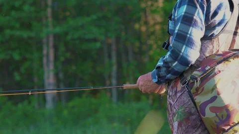 This is a fisherman going to the river to fly-fish Stock Footage 201842170