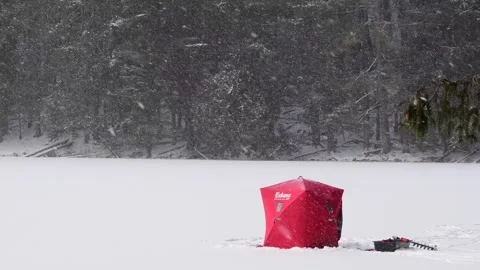 Fisherman on ice tent snow fall Stock Footage 262000904