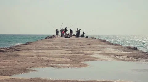 Fisherman on jetty Stock Footage 10881332