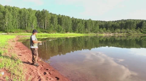 Fisherman on lake Stock Footage 41820160