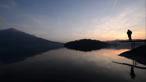 Fisherman on the lake at sunset. Stock Footage 75078218