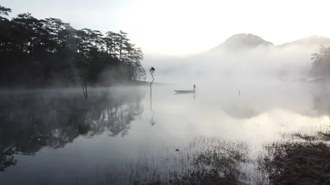 Fisherman on Lake in Vietnam Stock Footage