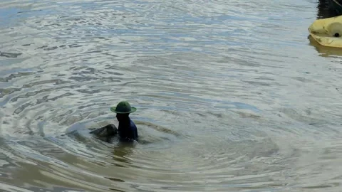 A fisherman is looking for fish in a boat Stock Footage 280953684