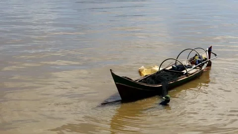 A fisherman is looking for fish in a boat Stock Footage 280953755