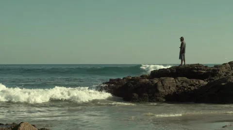 Fisherman looking at waves Stock Footage 45987152