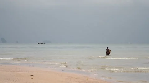 Fisherman with nets in the background longtail boat floats Stock Footage 56439886
