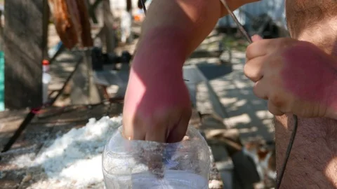 Fisherman prepares caught fish for drying in the sun. Stock Footage 113008230