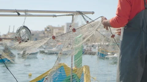 Fisherman prepares the net on the boat Stock Footage