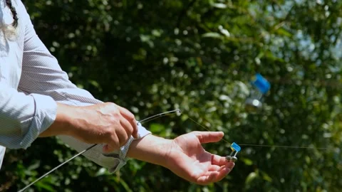 Fisherman Preparing Fishing Line with Float Outdoors Stock Footage 328356899