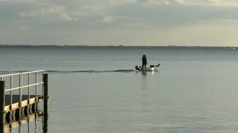 Fisherman pulling away from the dock Stock Footage 161847960