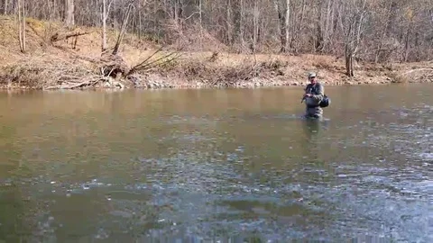 Fisherman pulls caught grayling Stock Footage 69227311