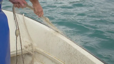 A fisherman pulls an empty fishing net in the Adriatic Sea, Bosnia. Stock Footage 243835691