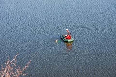 Fisherman pulls out fish Stock Photos