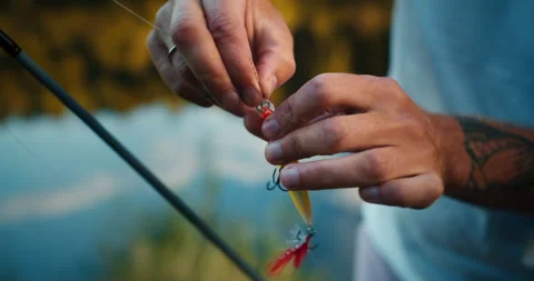 The Fisherman Puts The Bait On The Hook Stock-Footage 241612509