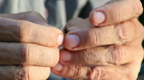 Fisherman putting bait worm on the hook. Close up. Video stock 27819784