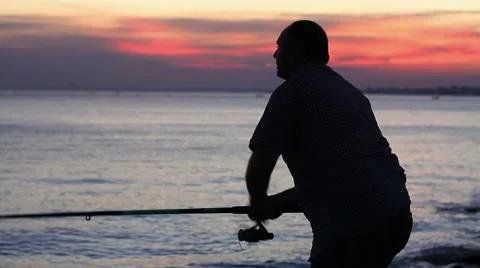 Reeling in Fish | Stock Video | Pond5