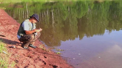 Fisherman releases fish Stock Footage 41542953