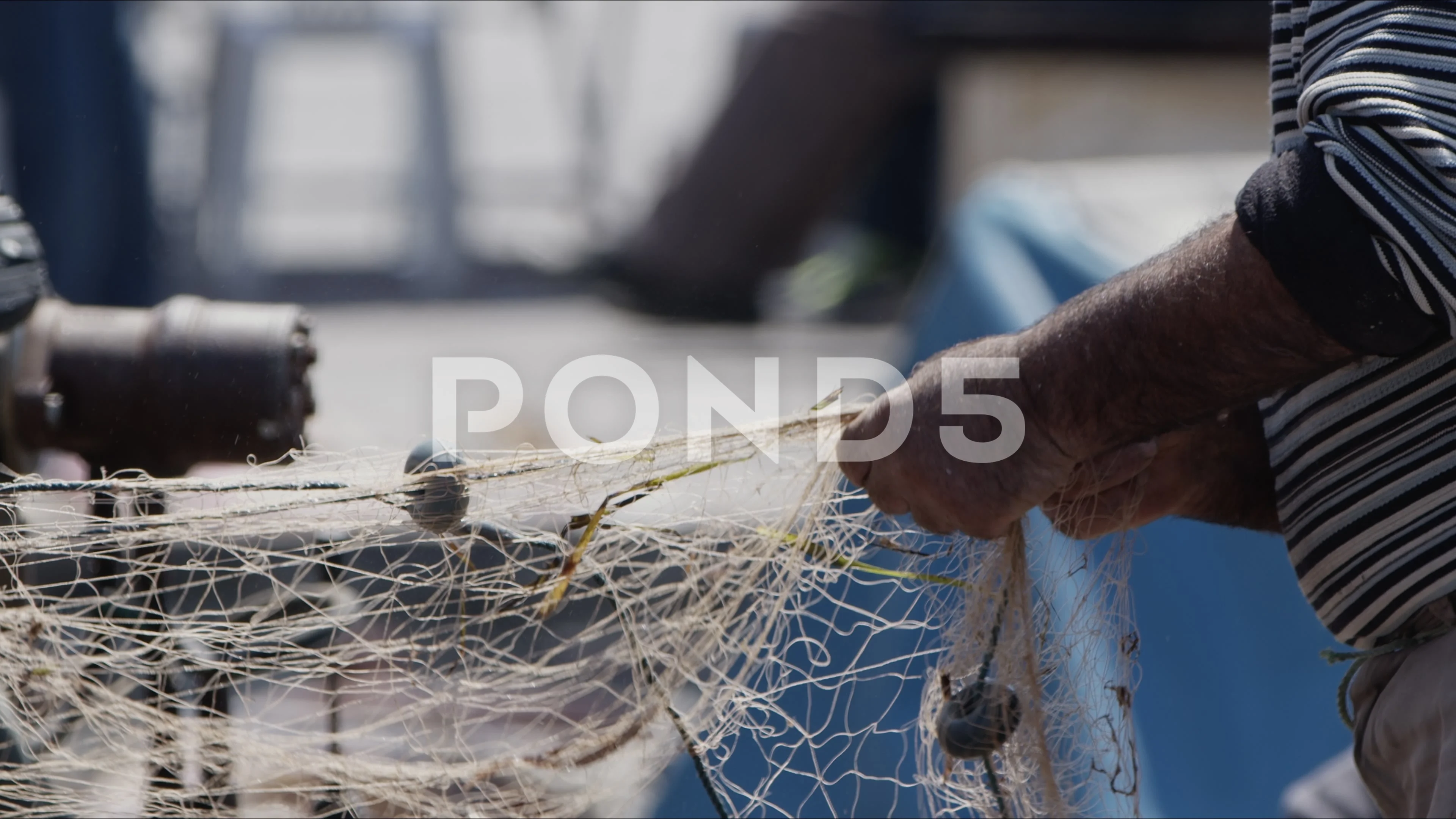 Fisherman is Repairing Fishnets on Fishi, Stock Video