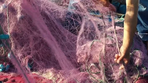 Fisherman Repairs Fishnets and Fishing Lines - Free HD Video Clips