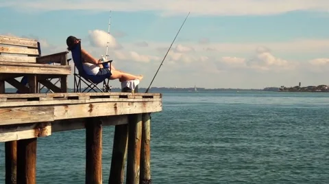 Fisherman resting on a Pier Video stock 45520399