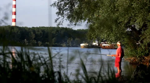 Fisherman. River in background. Stock Footage 34750942