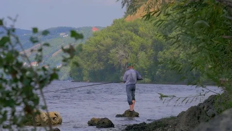 Fisherman on the river bank Video stock 79359317