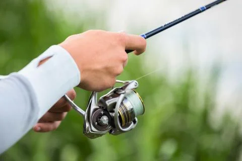 Fisherman on the river bank Stock Photos
