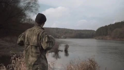 Fisherman on the river prepares to fish Stock Footage 131092996